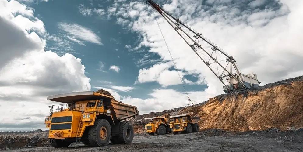 Large yellow mining haul truck operating at an open-pit mine